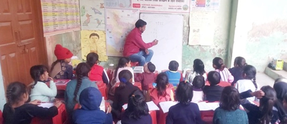 Teachers demonstrating concept using the different learning kits with their eager students