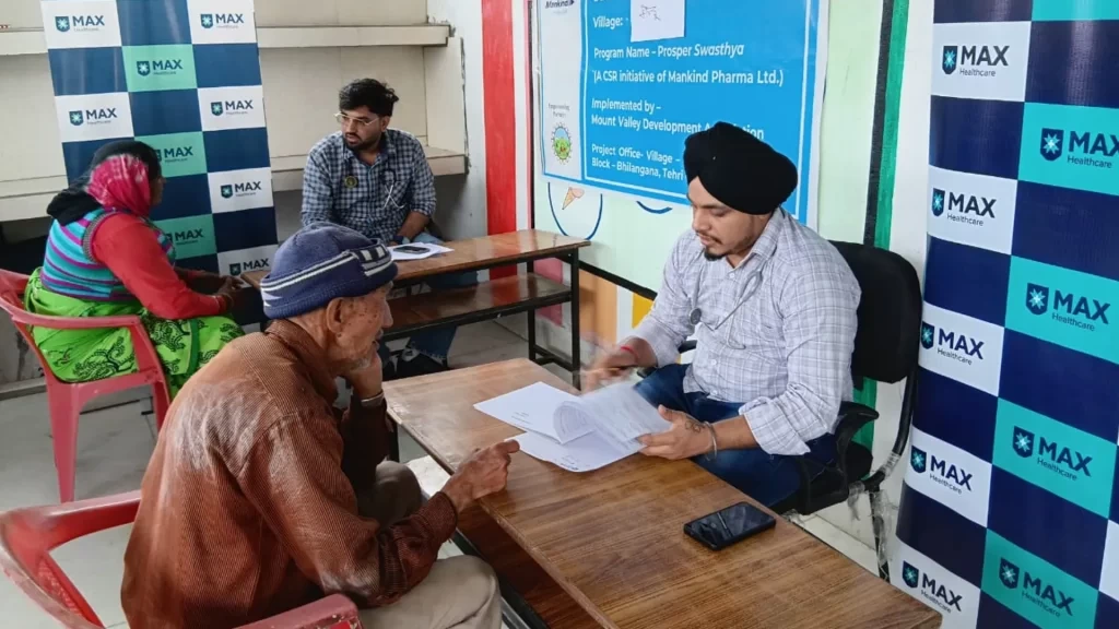 an oldman consultatation with health worker mvda